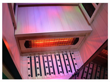 Lumin One 1-2 person infrared sauna interior, light Canadian Hemlock wood with glowing red far-infrared heater.