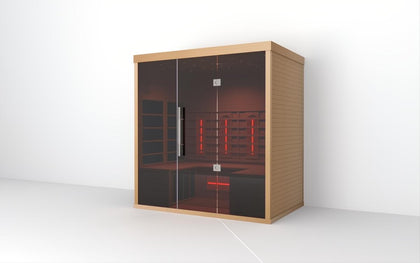 Lumin Three 3-person infrared sauna made from light Canadian Hemlock with dark glass door and red interior lights.