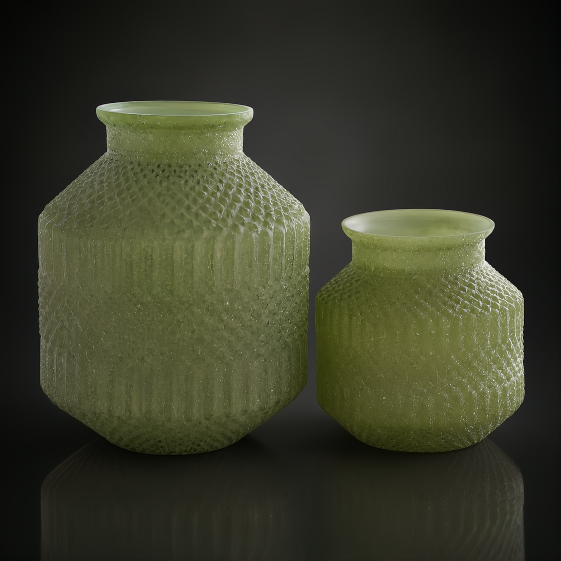 Set of two green marbled glass decorative accents with textured sculptural forms.