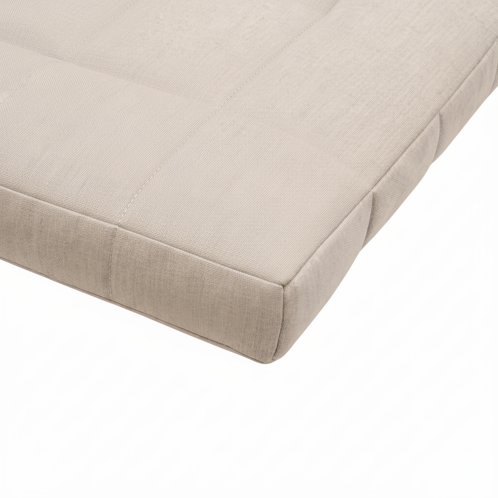 Close-up of a beige Sunbrella® acrylic cushion with tufted details and quick-dry foam.