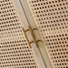 Close-up of a modern Surya Etewah sideboard with natural rattan doors, mango wood trim, and brass handles.