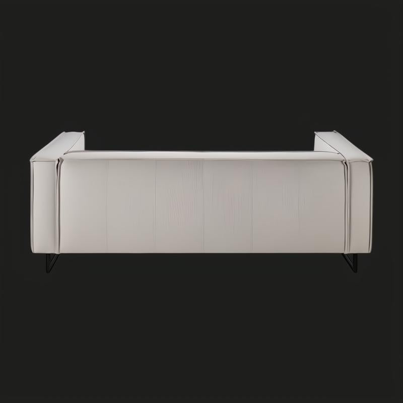 Surya Dylan light gray linen sofa with a modern design and black painted iron base.