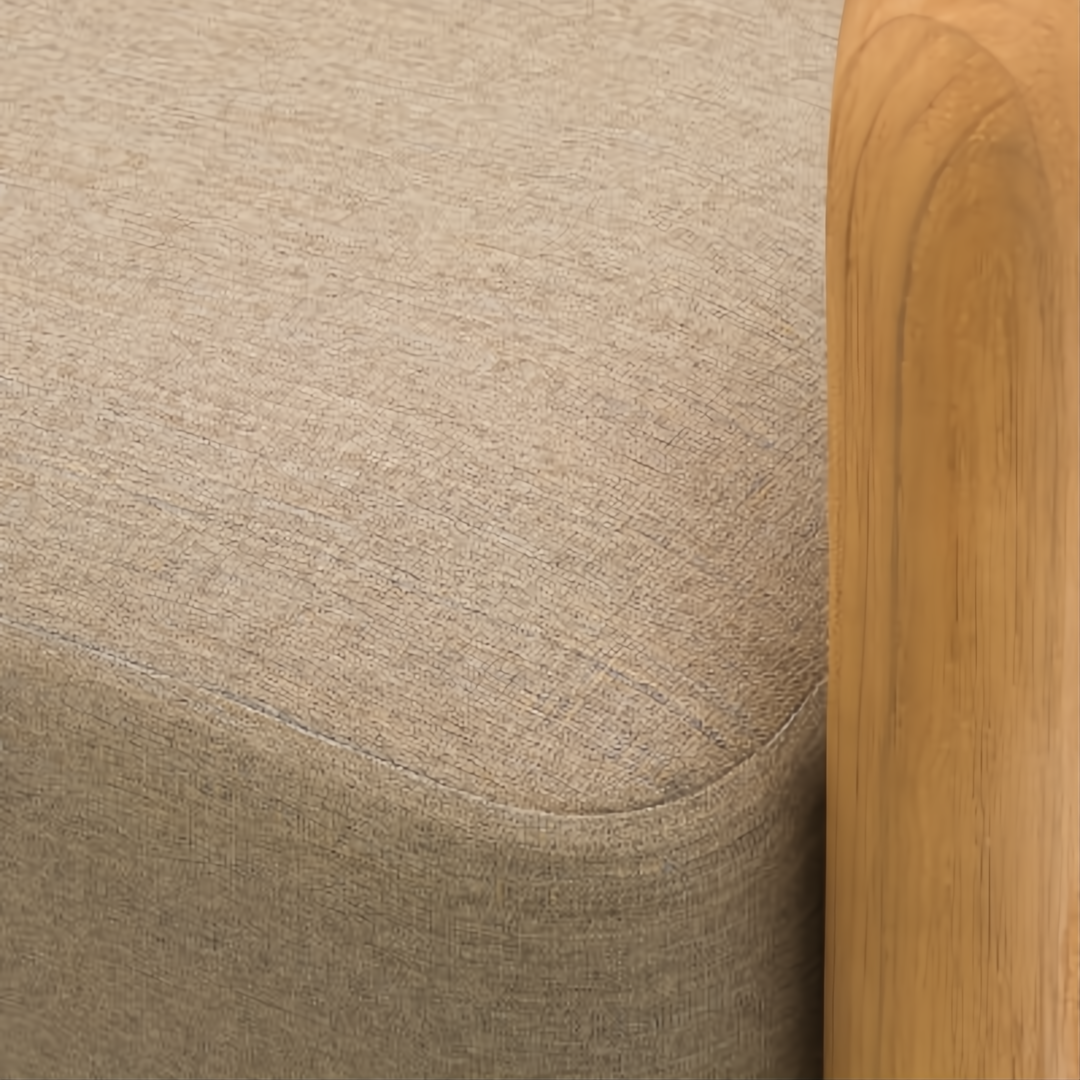 Close-up of a Surya Palma Swivel Chair with a beige Sunbrella® acrylic cushion and natural teak wood arm.