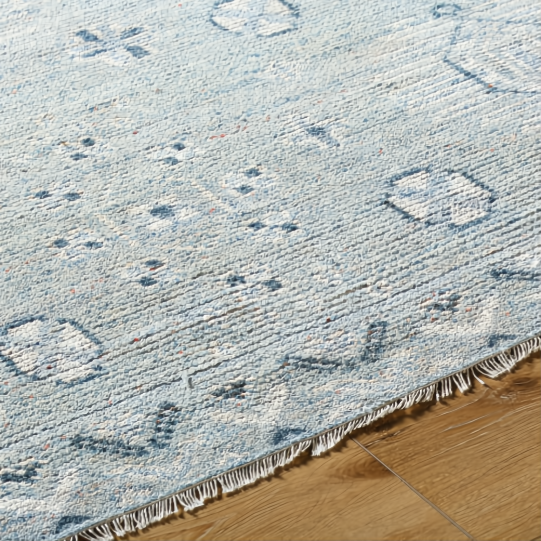 Hand-knotted Surya Almeria ALM2302 low pile area rug in multi-tone Denim, Black, Dusty Sage, Light Beige, Cream, Burgundy with fringe.