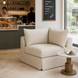 Taupe Surya Elenora modular chair with polyester upholstery in a cafe setting, beside a small marble-top table.