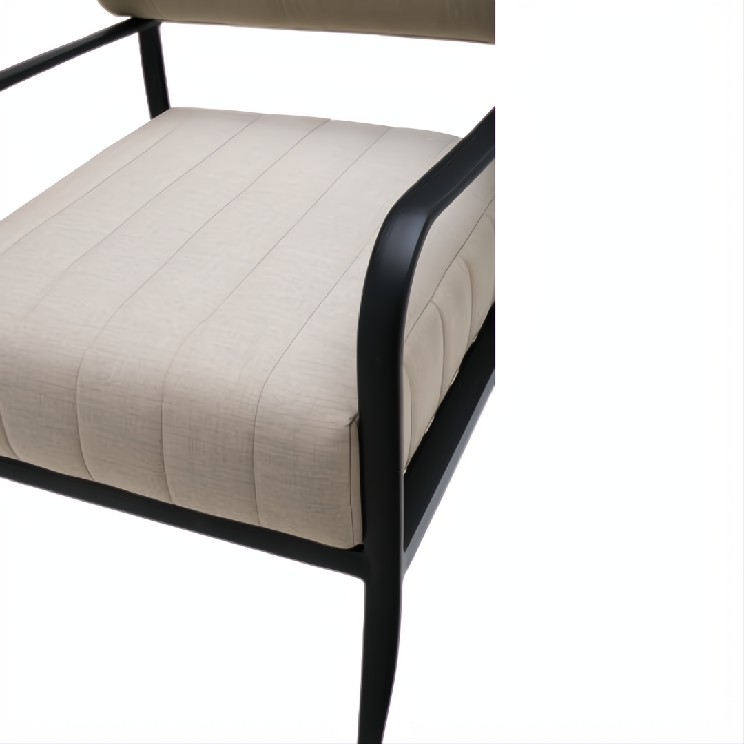Surya Antibes outdoor accent chair with beige Sunbrella® fabric, quick-dry foam, and black aluminum frame.