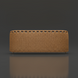 Woven light brown rattan headboard with a scalloped top edge, on a dark gray background.