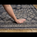 Hand-knotted Surya Almeria ALM-2300 low pile rug with black, gray, beige, and blue geometric patterns.