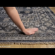 Hand-knotted Surya Almeria ALM-2300 low pile rug with black, gray, beige, and blue geometric patterns.