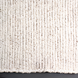 Close-up of a Surya Azalea AZA-2326 handmade rug, showing its light beige, black, and gray woven recycled PET yarn texture.