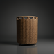 Woven light brown wicker laundry hamper with circular cutouts at the top and short wooden legs.