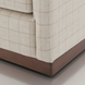 Surya Glendon swivel chair with light beige plaid polyester-linen upholstery and brown rubber wood base.