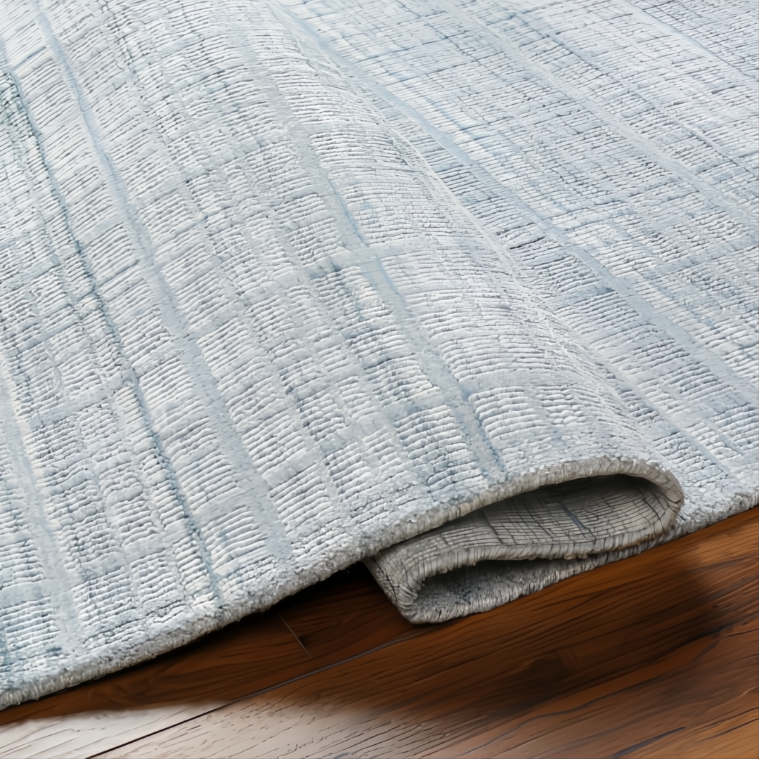 Light blue Surya Fresno FNO2304 area rug, hand-loomed from recycled PET yarn, with subtle striped texture.