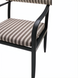 Surya Antibes dining arm chair with multi-color striped Sunbrella upholstery and black aluminum frame.