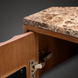 Close-up of a brown Surya Skopa Cabinet with a marble top and white oak frame, showing an open door.