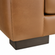Close-up of a Surya Alba sofa corner, showing brown leather upholstery and a charcoal base.