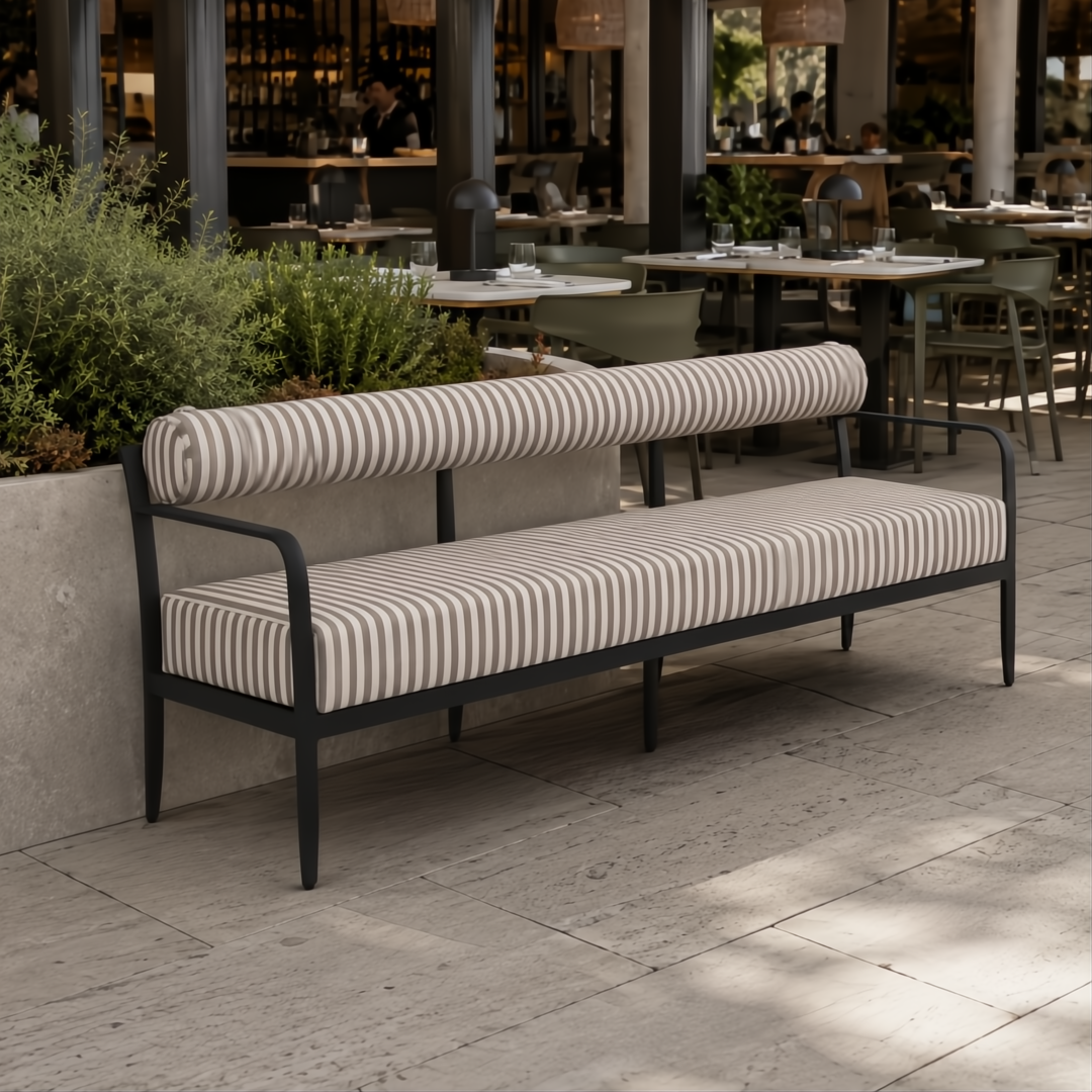 Surya Antibes outdoor sofa with brown and beige striped Sunbrella fabric, black aluminum base, and bolster back.