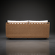 Marvella sectional right arm sofa with woven wicker back and white cushions.