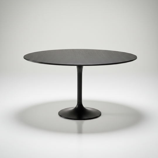 Surya Anatalia round dining table with a black polished marble top and black iron pedestal base.