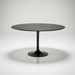 Surya Anatalia round dining table with a black polished marble top and black iron pedestal base.