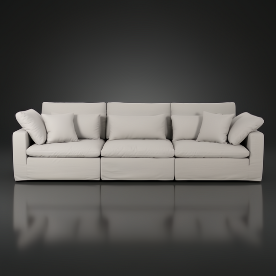 Surya Avington 130" wide slipcover sofa in light linen-polyester, featuring a relaxed, modern design.