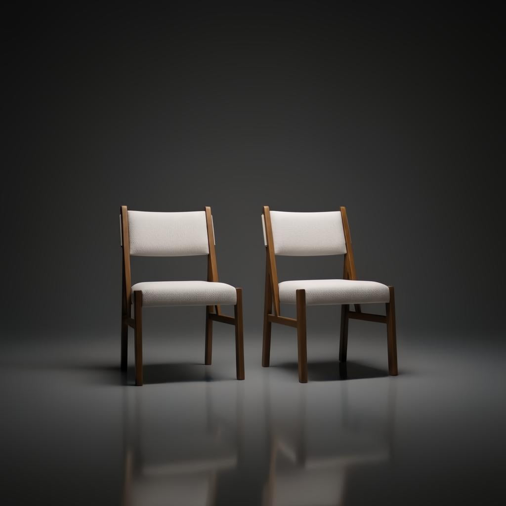 Two Surya Bergene dining chairs with light beige upholstery and brown rubber wood frames.