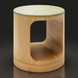 Surya Poros end table with a green cork veneer top and a light brown oak base with a curved cutout.