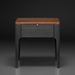 Brown oak veneer top end table with a black manufactured wood drawer and rubber wood legs.