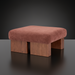 Surya Mirava Ottoman, a square upholstered ottoman with a textured rust-colored polyester cover and four wooden block legs.