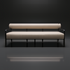Surya Antibes outdoor sofa with light beige Sunbrella upholstery and a sleek black aluminum frame.