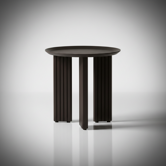 Blackened mango wood Surya Agnes end table with round top and zigzag fluted legs.