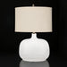 Surya Bentley accent table lamp with a white glass base and a cream fabric drum shade.