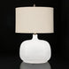 Surya Bentley accent table lamp with a white glass base and a cream fabric drum shade.
