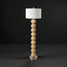 Surya Algarve modern accent floor lamp with a stacked light wood resin base, white linen shade, and metal foot.