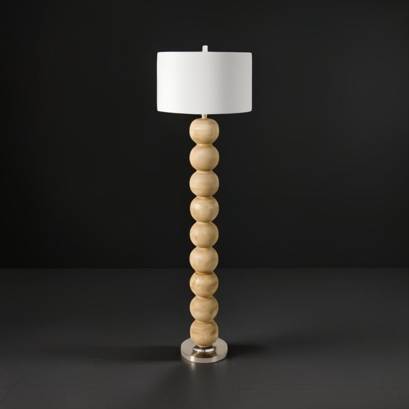 Surya Algarve modern accent floor lamp with a stacked light wood resin base, white linen shade, and metal foot.