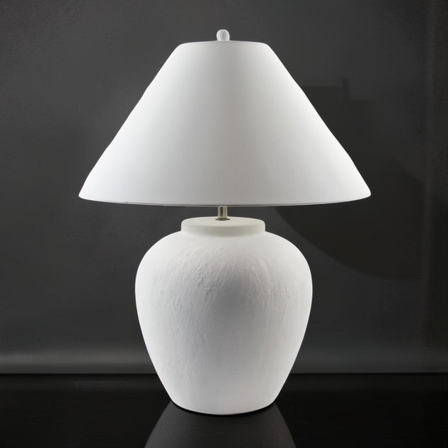 Surya Arion accent table lamp with a cream ceramic base and white linen shade.