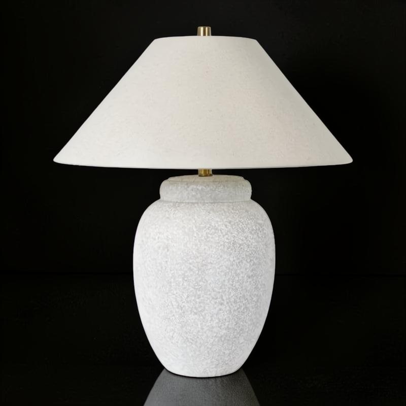 Surya Capelli accent table lamp with a textured white ceramic base and a light fabric shade.