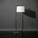 Modern black and gold sculptural floor lamp with an ivory linen shade, casting a soft glow.