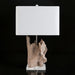 Darby Accent Table Lamp with a natural wood-look sculptural base, clear acrylic stand, and white fabric shade.