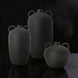 Surya Acanceh CCH-003, a set of three black ceramic decorative vases with sculptural, minimalist design and small handles.