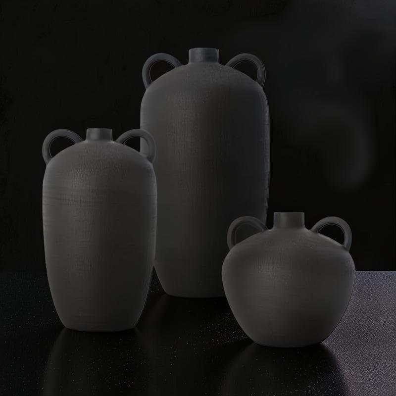 Surya Acanceh CCH-003, a set of three black ceramic decorative vases with sculptural, minimalist design and small handles.