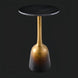 Minimalist Surya Alva end table with a black marble top and metallic bronze ombre iron base.