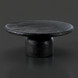 Surya Koben black sandblasted mango wood coffee table with a round top and turned base.