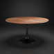 Round Surya Anatalia dining table with a brown natural acacia top and black powder-coated iron base.