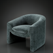 Surya Cascadia Accent Chair, a compact teal polyester upholstered chair with a curved back and clean design.