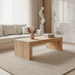 Surya Coburn minimalist modern coffee table, brown mango wood, 16"H x 48"W x 24"D, in a living room.