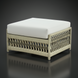 Cream Surya Winder outdoor ottoman with a cushioned Sunbrella® top and woven aluminum base.