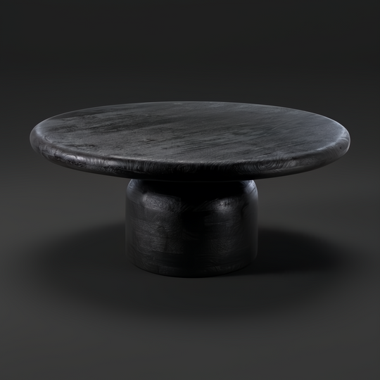 Black sandblasted mango wood Koben coffee table with a round top and turned base, showcasing exposed wood grain.