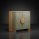 Surya Poros Cabinet: green lacquered cork veneer doors, brown natural oak base, and round wooden handle.