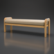 Surya Palma outdoor bench with light wood frame, woven armrests, and a long beige cushion.